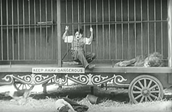 Figure 6 Figs. 4-6: According to Bazin, in Chaplin’s The Circus (1928), individual takes of Chaplin and the Lion (Figs. 4-5) are given greater comedic and aesthetic power by longer takes of Chaplin actually in the presence of the lion (Fig. 6). The cage becomes a space of comedy because of what Bazin called the “comedy of space”: the scene’s uninterrupted duration of time and unity of space provide a suitable platform for the high risks of humor (52).