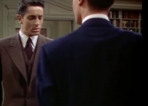 Figure 9 Figs. 7-9: Hitchcock famously masked the 11 cuts in Rope (1948), each of which lasts between three and nine minutes, often by focusing on a dark object, allowing for a momentary blackout so that the camera could be reloaded or refocused. Here the camera pans toward the back of Brandon’s suit, cuts, and then pans back up over his shoulder.